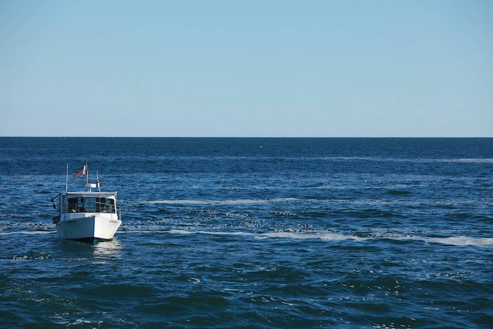 22197188_web1_white-boat-in-beach-during-day-time-499679