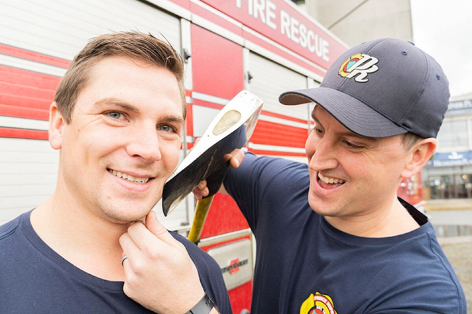 Brody Bishop “shaves” Ryan Fuzi’s face before the start of Movember in Prince Rupert B.C., on Oct. 21. (Photo: Norman Galimski/The Northern View)