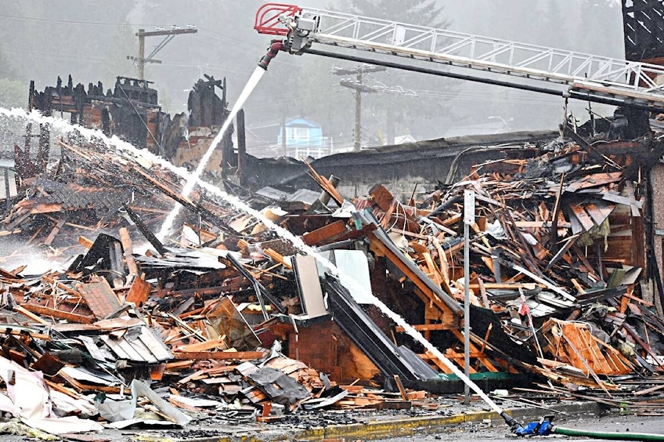 A bulldozed Belmont Hotel still smoulders on May 2 more than 15 hours after an initial Prince Rupert Fire Rescue call out to the adjacent building Roses Oriental Food and Gifts. (Photo: K-J Millar/The Northern View)