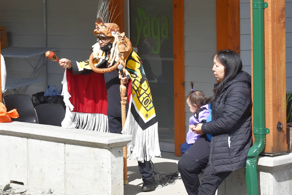 Simogit Gils’en (Ronald Nyce) blesses the newly rebranded Yaga Café Garden Co. on May 14. (Thom Barker photo)