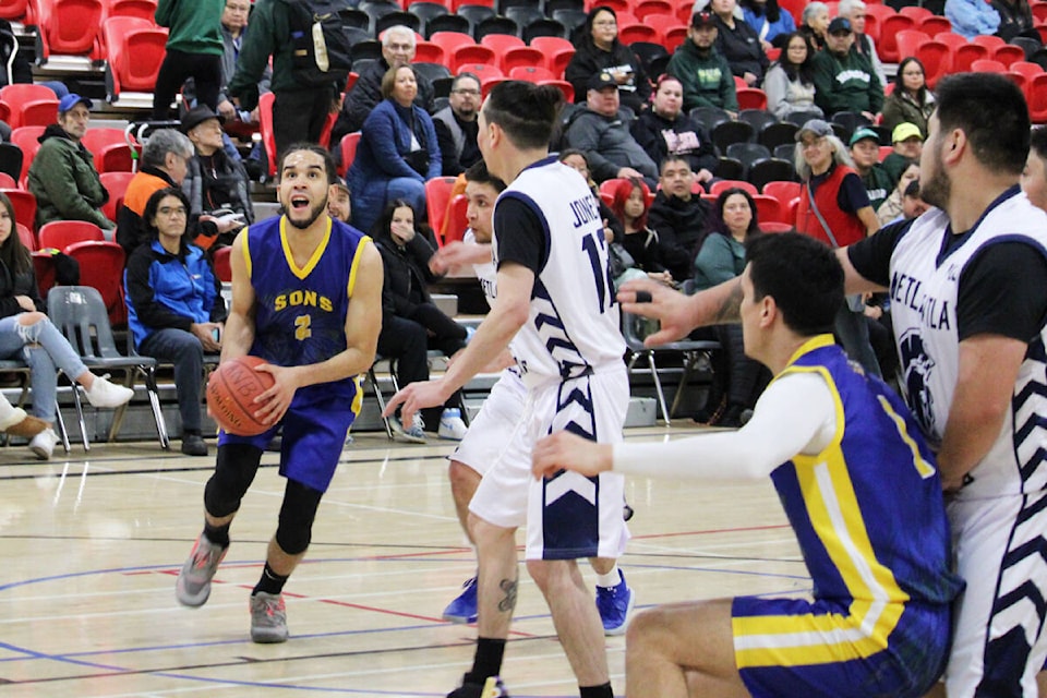 Sons of Gingolx (Kincolith’s) Perry Terrell Jr. prepares to go up for a basket en route to a 19 point performance and a win against Metlakatla BC Spartans in the opening game of the 2023 All Native Basketball Tournament Feb. 11. (Thom Barker photo)