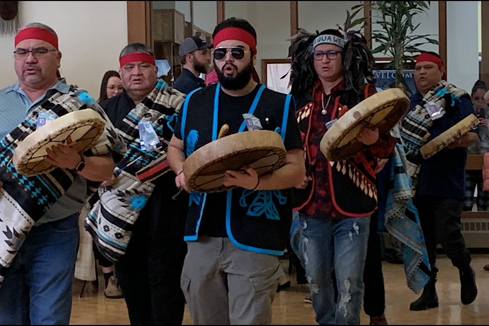 Drummers sing as they walk into the Sts’ailes Lhawathet Lalem (Healing House) on Friday, March 3. (Adam Louis/Observer)