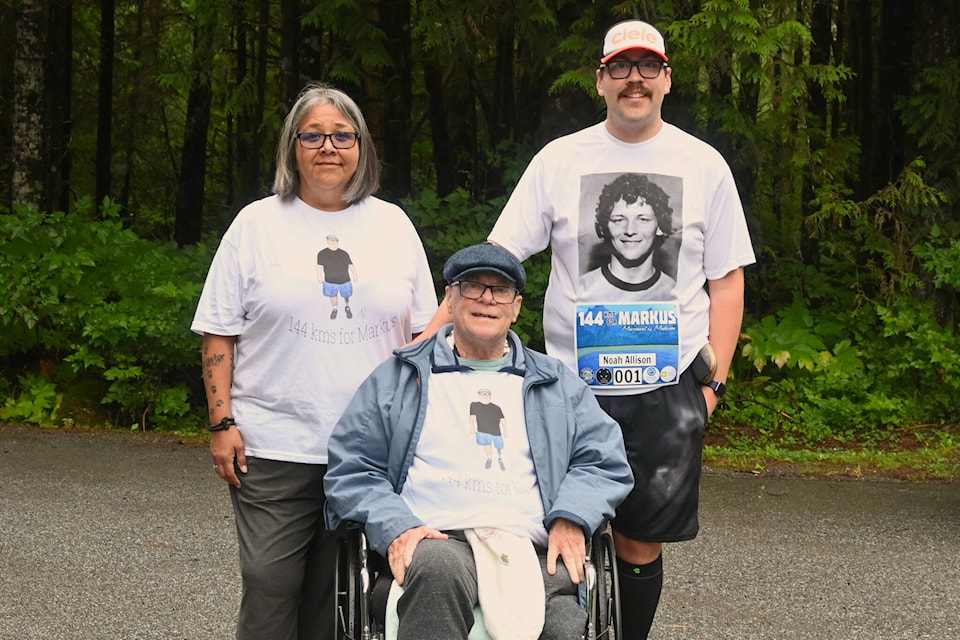 Noah Allison and his parents Markus and Char Etzerza before Noah heads out on his first leg of the day in 2023. (Seth Forward/Northern View)