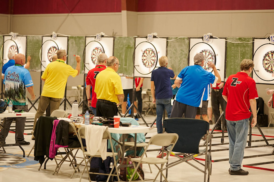 Darts competitors line up. (BC 55-Plus Games photo team)