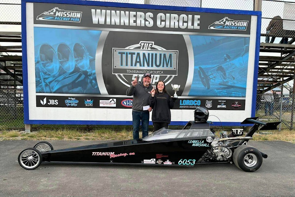 Izabella Marshall, with her dad Jody, after winning on June 17 the junior dragsters Division Six competition at the Mission Speedway in the Fraser Valley. (Contributed)