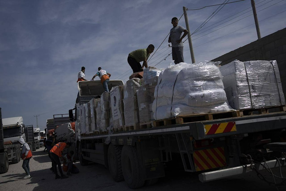 Trucks with humanitarian aid for the Gaza Strip entered from Egypt in Rafah on Saturday, Oct. 21, 2023. (THE CANADIAN PRESS/AP/Fatima Shbair)