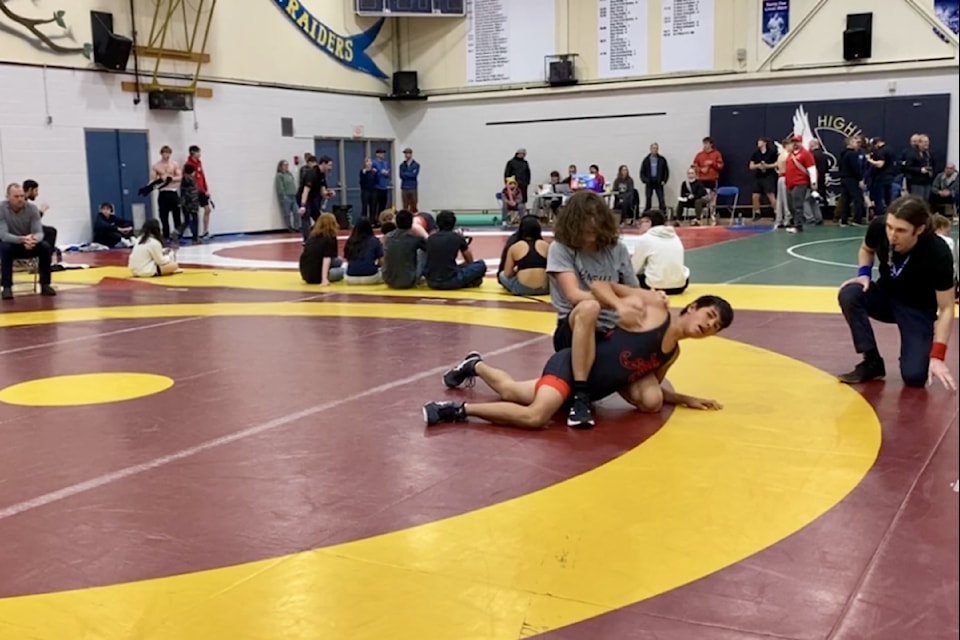 Filipe Bettencourt Da Rosa defeats Alberni District Secondary School's Tj Hernandez by a 17-8 technical fall to win silver in the 60 kg division at the Comox Valley wrestling tournament. (Tyson Whitney photo)