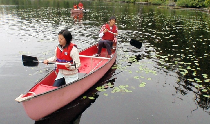 Visitors from Numata try their paddles at Beaver lake.