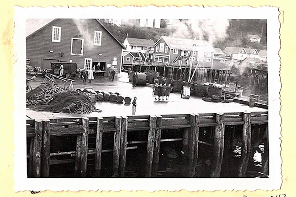 A group standing on the old B.C. Packers’ wharf waiting for the steamer to come in circa 1940’s. (Image courtesy of the Alert Bay Public Library and Museums)