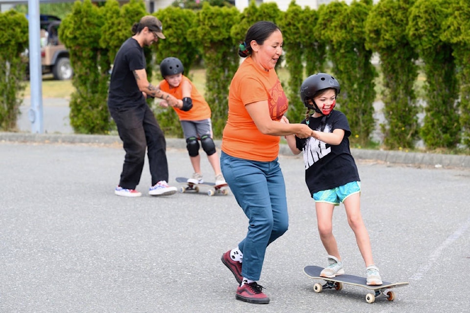 Rose Archie, one of the founders of Nations Skate Youth, teaches a participant during the organization’s skateboarding camp at Homalco First Nation on July 1, 2021. Photo by Sean Feagan / Campbell River Mirror.