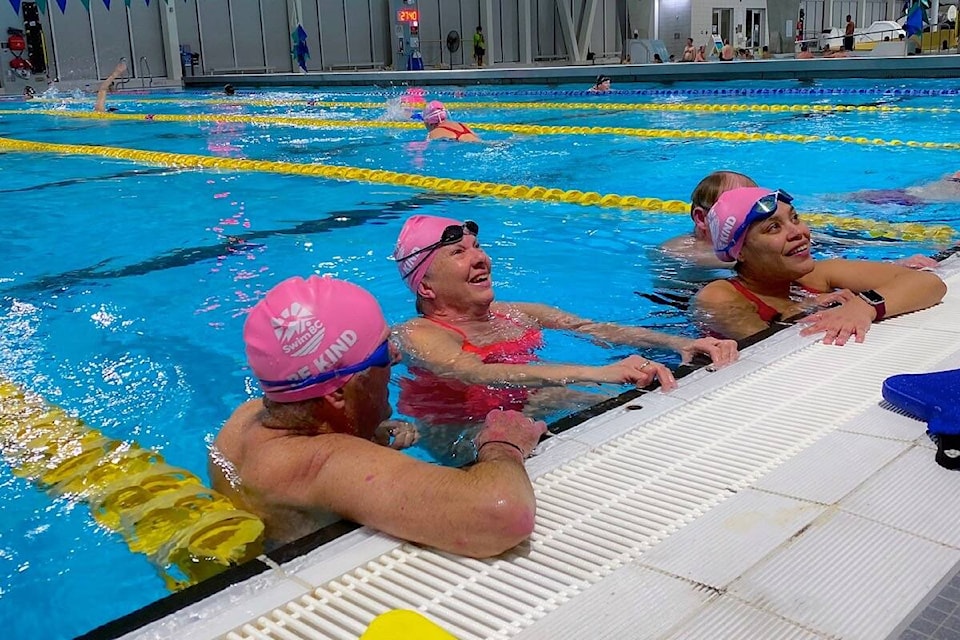 As others don pink t-shirts for anti-bullying day (Feb. 23), swimmers across British Columbia – including White Rock Wave members Bill Blair, Debbie Dunn and Cindy Yoc – are wearing pink caps as part of an initiative set up by Swim BC. (Contributed photo)