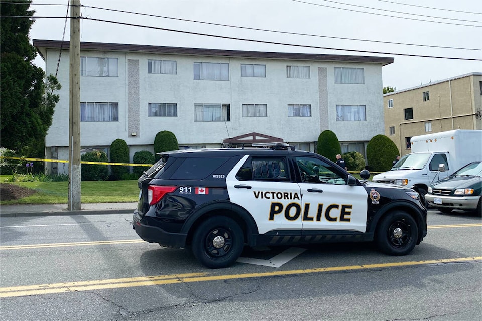 Victoria police respond to the 2500-block of Quadra Street, where a man barricaded himself in an apartment. (Justin Samanski-Langille/News Staff)