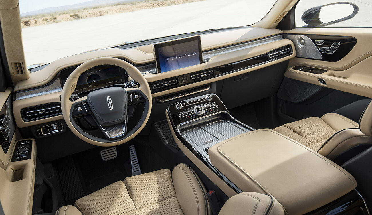 The screen popping out of the dash is the only distraction to an otherwise clean and elegant interior. Note the transmission is operated via a row of dash-mounted buttons. Photo: Lincoln