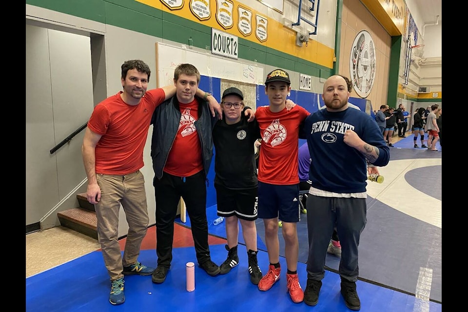 From left to right: PHSS Athletic Director Paul Cagna, Brody Chambers, Carter Chastin, Auzton Shaw, and wrestling coach Tyson Whitney stop for a photo at the end of the tournament. (Submitted photo)