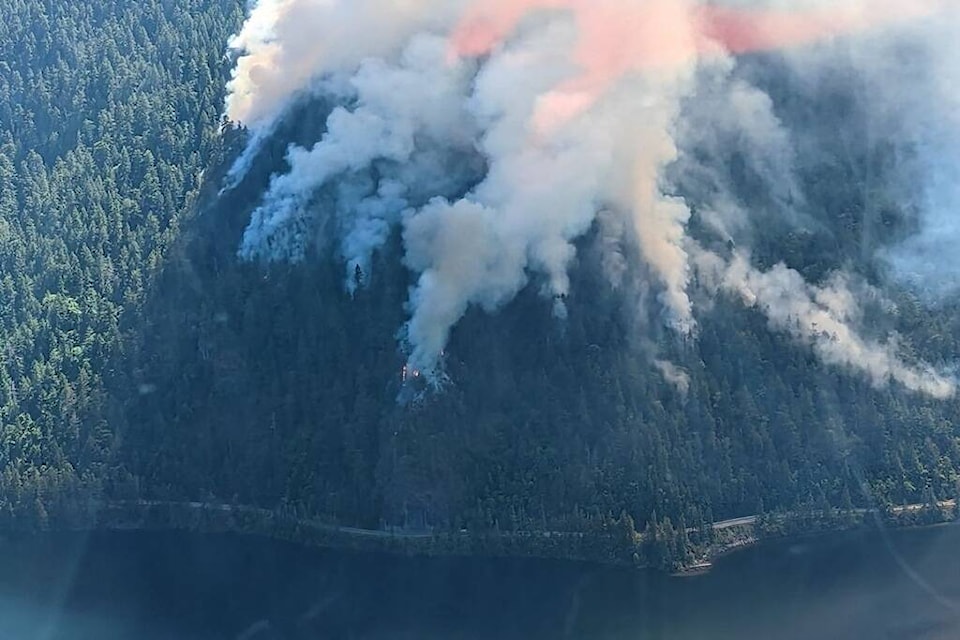 This aerial photo shows the fire burning above Highway 4. (Courtesy B.C. Ministry of Transportation)