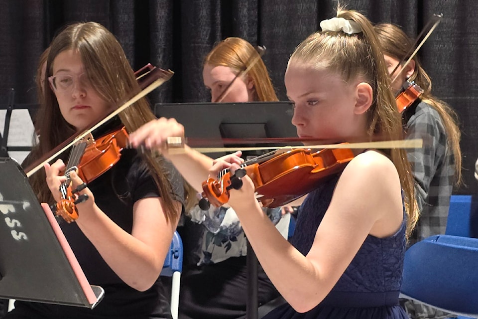 The string ensemble of Barriere Secondary and Elementary schools playing 'O Canada' to start the graduation ceremony on June 14. (Hettie Buck/North Thompson Star-Journal)
