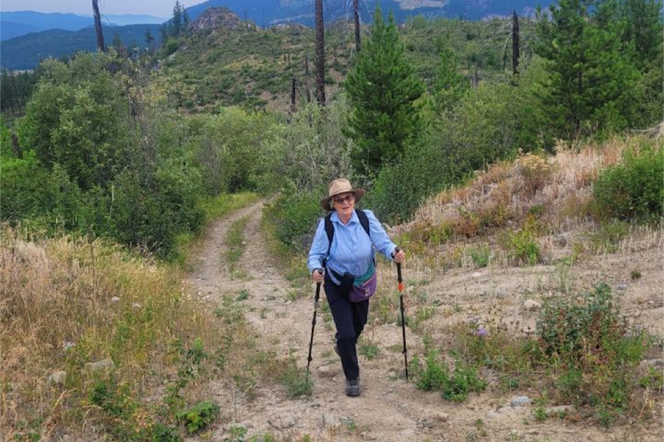 Judith Klontz of Barriere with the Barriere Outdoor Club hiking on Armour Mountain on July 24. 