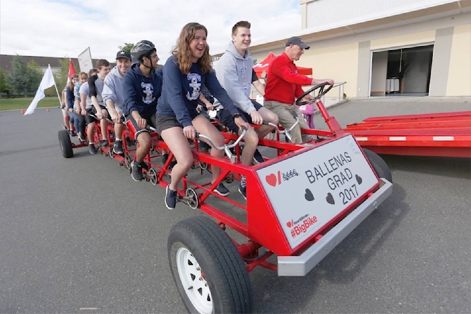 Adam Kveton Photo Ballenas Secondary School 2017 grads head off on the Heart and Stroke Foundation’s Big Bike, which was in Parksville on Wednesday, May 24. The Big Bike came to Barriere on June 8, 2017. 