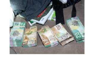 21540NewS.4.20110114170721.MoneySeizedcmyk.JPG_20110117