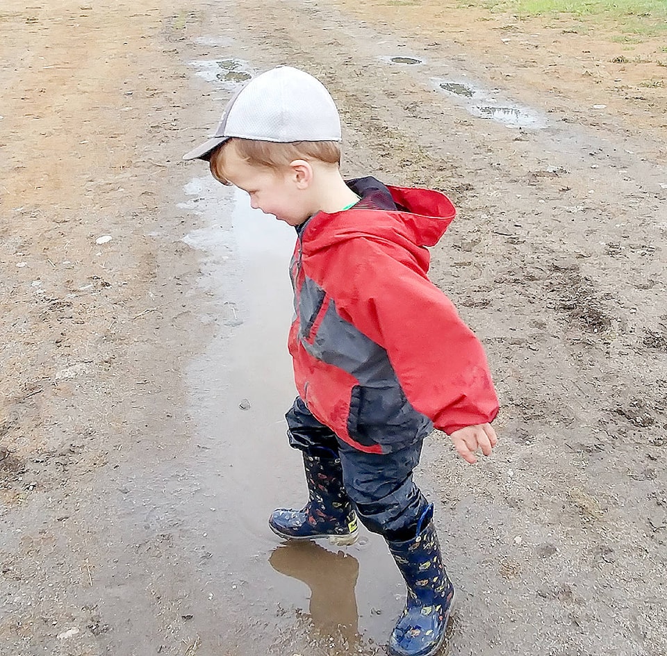 16924278_web1_Kid-playing-in-puddle