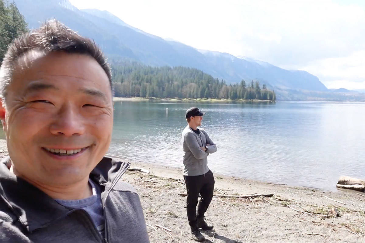 Henry Wang (left) was one of four members with Divers for Cleaner Lakes and Oceans who was out at Cultus Lake on March 28 and 29 hauling trash out of the waters. (YouTube/Henry Wang)