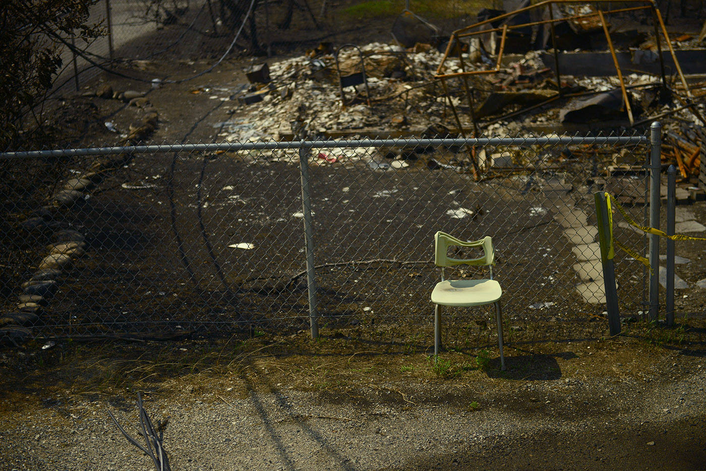A partially melted chair stands amid the burnt rubble on Main Street in the Village of Lytton, B.C. on Friday, July 9, 2021 following a massive wildfire that tore through the town destroying 90 per cent of it. (Jenna Hauck/ ronaldomanosa)