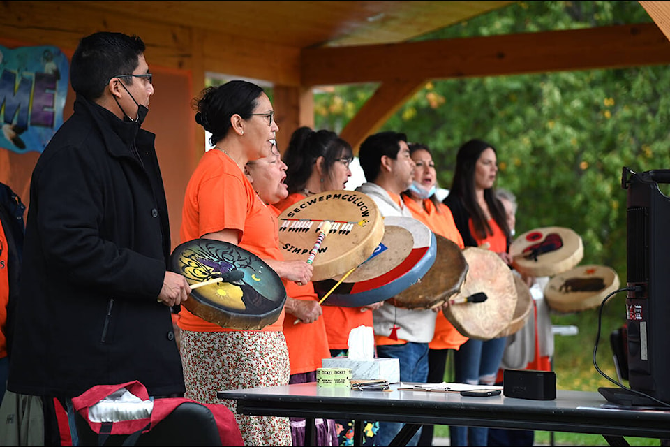 Indigenous Elders and community leaders and members sing an honour song. (Stephanie Hagenaars/Clearwater Times)