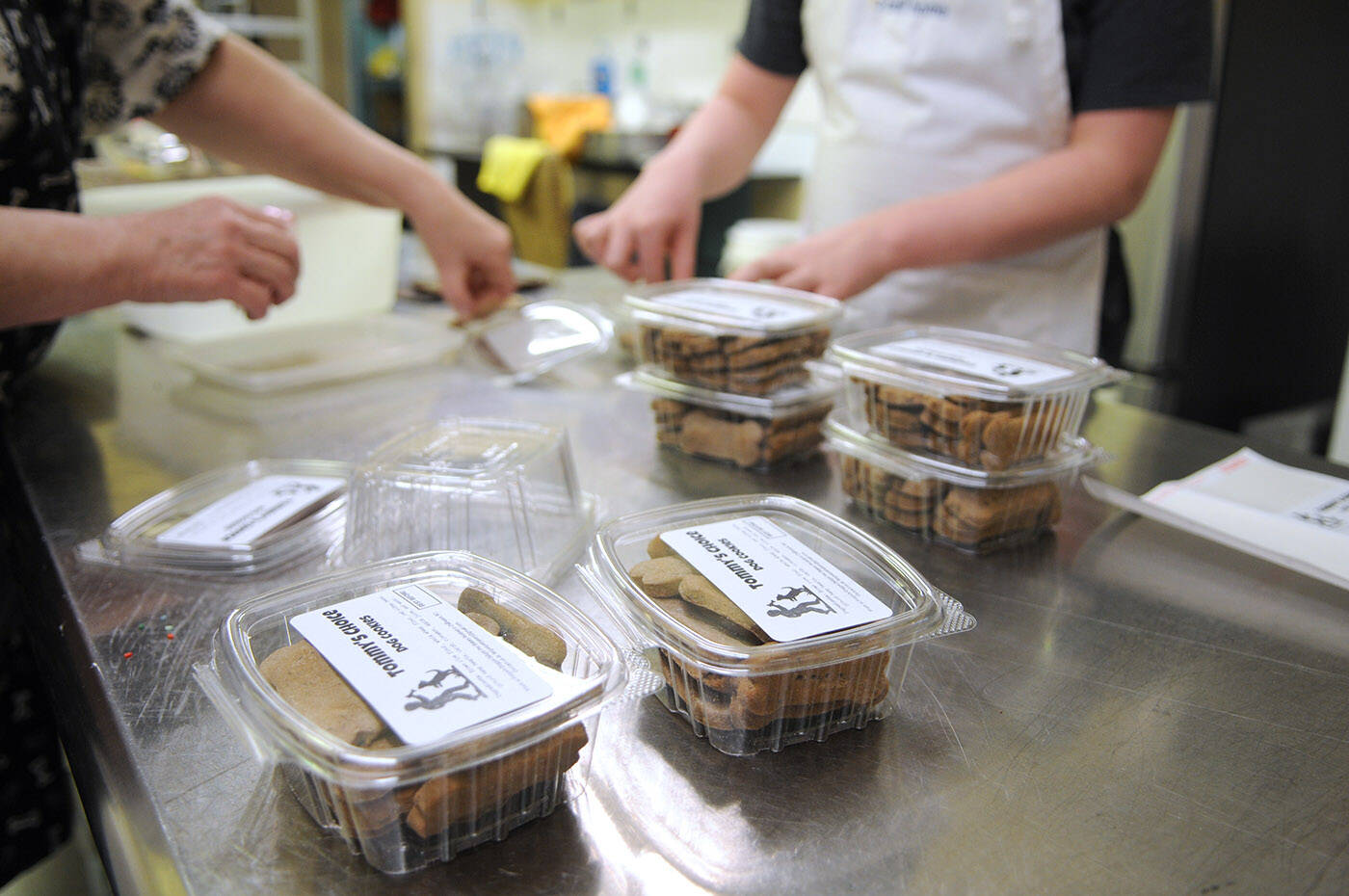Ryder Newhouse will be delivering these dog cookies that he made at Fergies Doggie Delight Pet Bakery to folks on his newspaper route just in time for Christmas. (Jenna Hauck/ Chilliwack Progress)