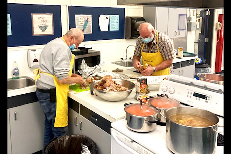 Members of the Barriere Lions Club joined with many other community members to help prepare and serve the lunch. (BSS photo)