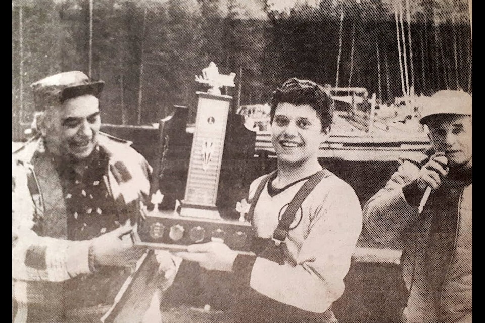 (L-r) Mount Olie’s Lions Club president, Bill Foucault presents Udo Wittich who gathered the most pledges with the first place trophy, with Clearwater’s M.C. Bill Mattenly announcing the winners of Snowarama 1982 in Little Fort, B.C. (NT Journal)