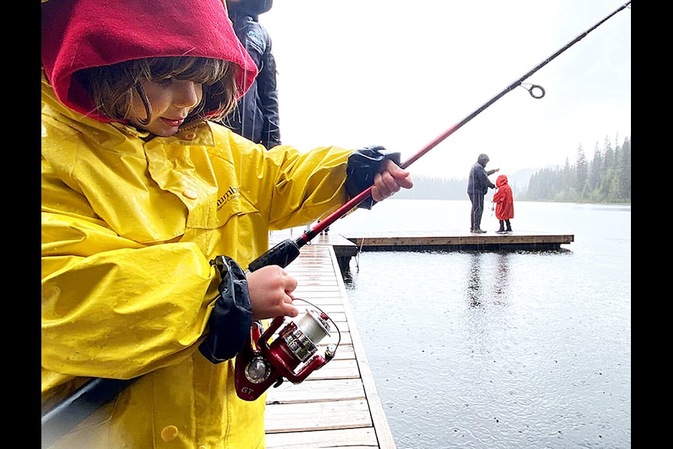 Learning to fish takes a good amount of concentration as shown by this youngster during the June 5, GoFish BC Learn to Fish Day hosted at Dixon Lake by Barriere Nature Kids. (C. Staples photo)