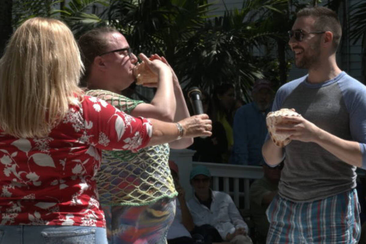 French horn musician and Royal Canadian Navy Naden Band member Alliszon Zaichkowski, centre, plays one of her 20 conch shells at a competition in Key West, Fla., during March 2020. Zaichkowski went on to win the contests womens division and perform on Canadas Got Talent. (Courtesy of Alliszon Zaichkowski)