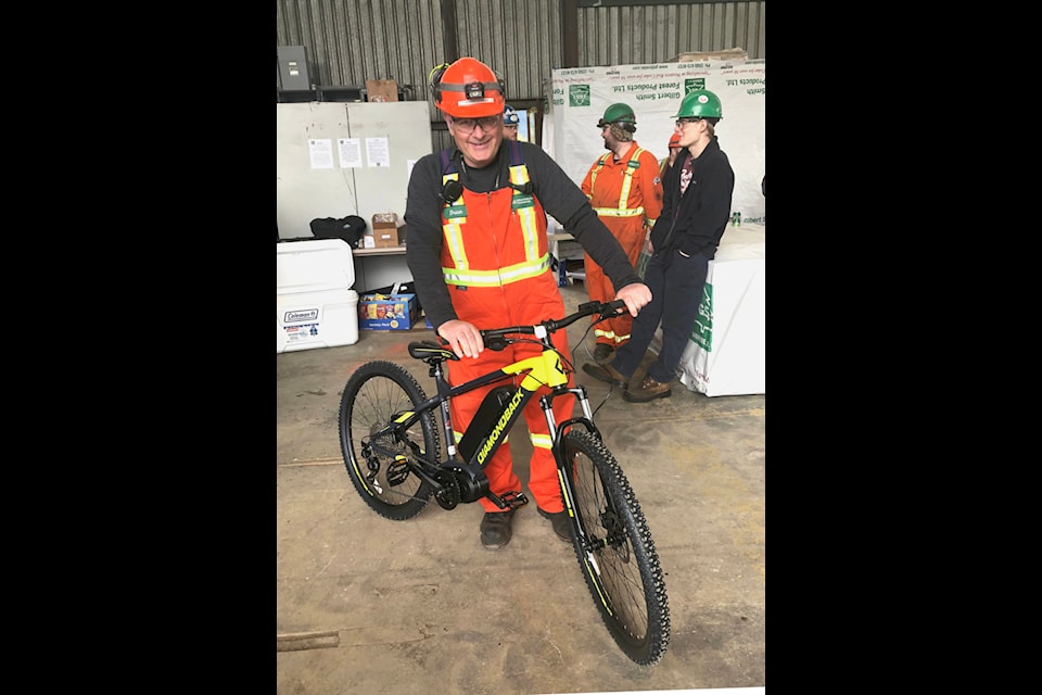 Employee Brian Dorish was the lucky winner of an E-Bike during a Safety BBQ at Gilbert Smith Forest Products Limited, all part of celebrations held at the mill during Safety and Health Week, May 1-7. (D. Woods photo)