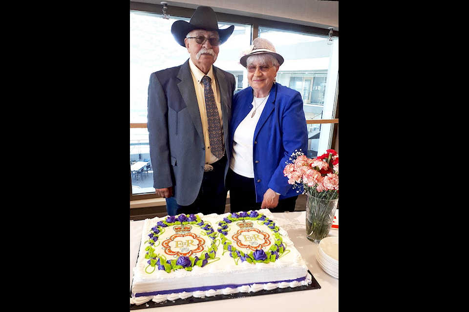 Jill Hayward and husband of almost 50 years, Bob, standing behind the Platinum Jubilee cake at Thompson Rivers University on Sunday, June 12. (Submitted photo)