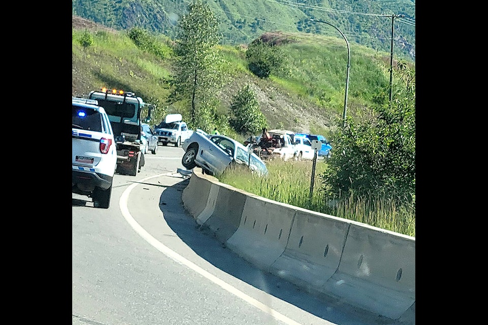 A car is shown hung up on a cement abutment on the west side of Highway 5 just north of the Agate Bay Road turnoff the afternoon of Saturday, June 25, while one lane traffic moves through the area. (Aireal Greene/Facebook photo)