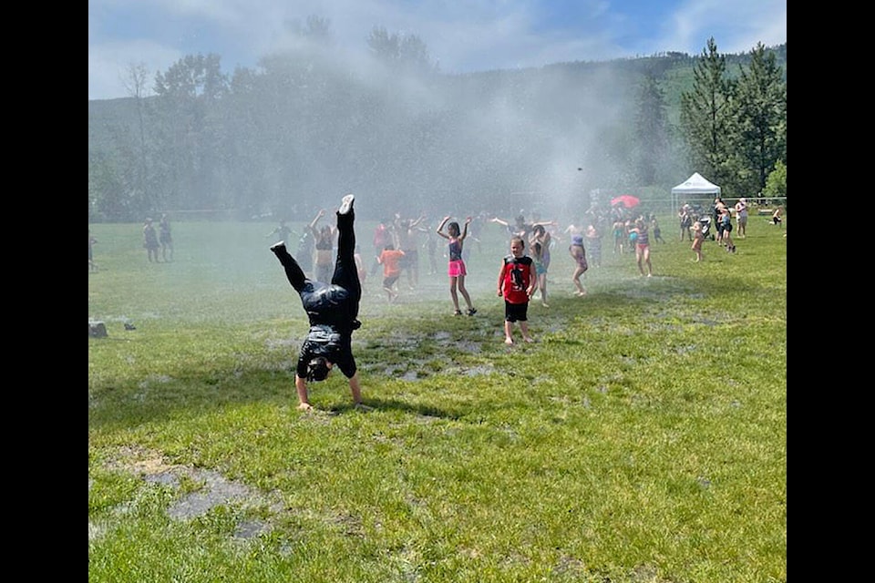 Barriere Fire Chief Ashley Wohlgemuth shows some fancy cartwheels during the Barriere Elementary PAC Fun Day at the schoolon Monday, June 27. (Wanda Nystoruk photo)