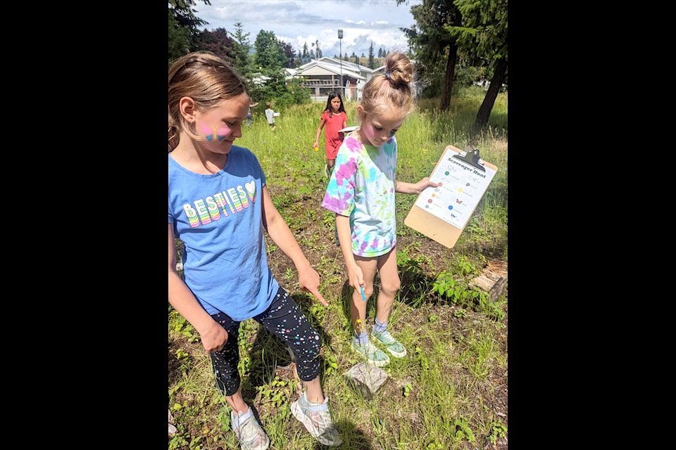 Barriere Literacy’s Toonie-A-Day summer camp participants Lily, Grayce and Anna are shown participating in a scavenger hunt at the Ridge the week of July 4. (Seanna Nickel photo)