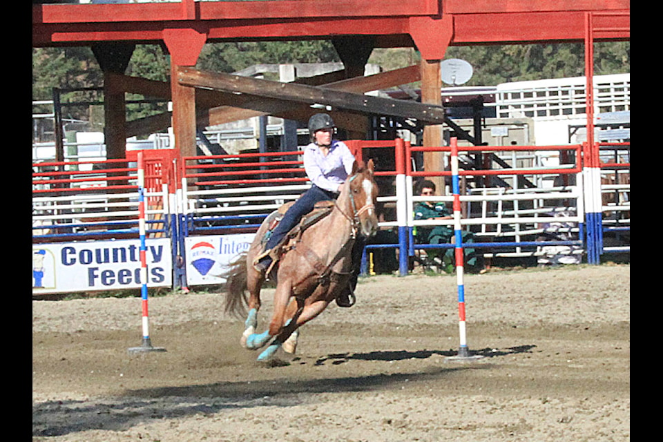 Kelowna’s Simone Lamberton weaves her horse as quickly as she can through a number of poles during competitions at the BC High School Rodeo held at the North Thompson Fall fairgrounds in Barriere on Oct-8-9. (Jill Hayward photo)