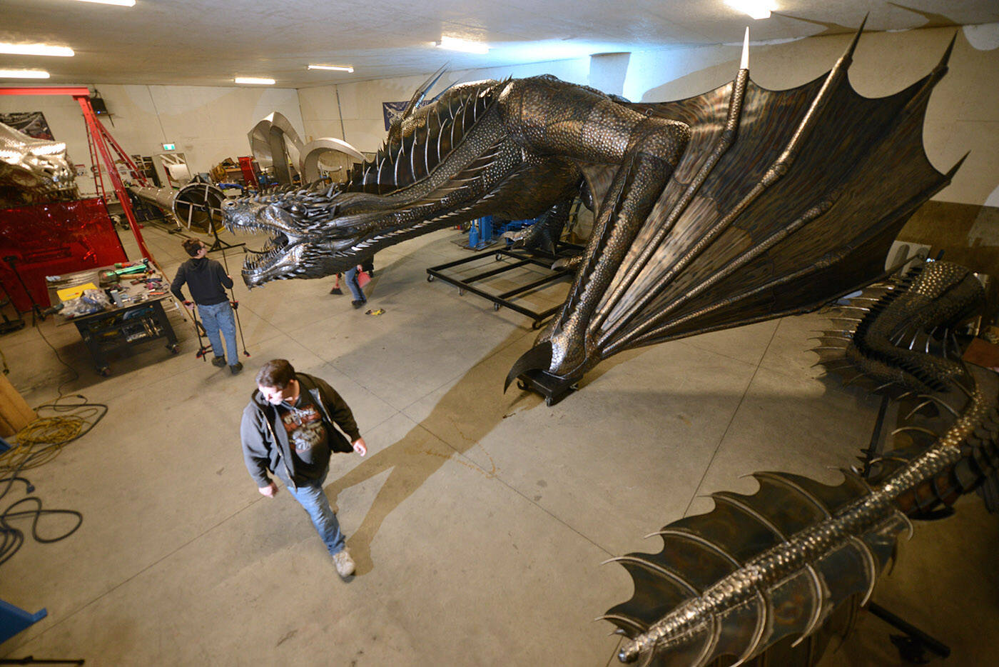 The 15,000-pound dragon is so big it wont fit in Kevin Stones workshop intact. The tail (at right), wings and feet can all be removed in order to transport it. (Jenna Hauck/ Chilliwack Progress)