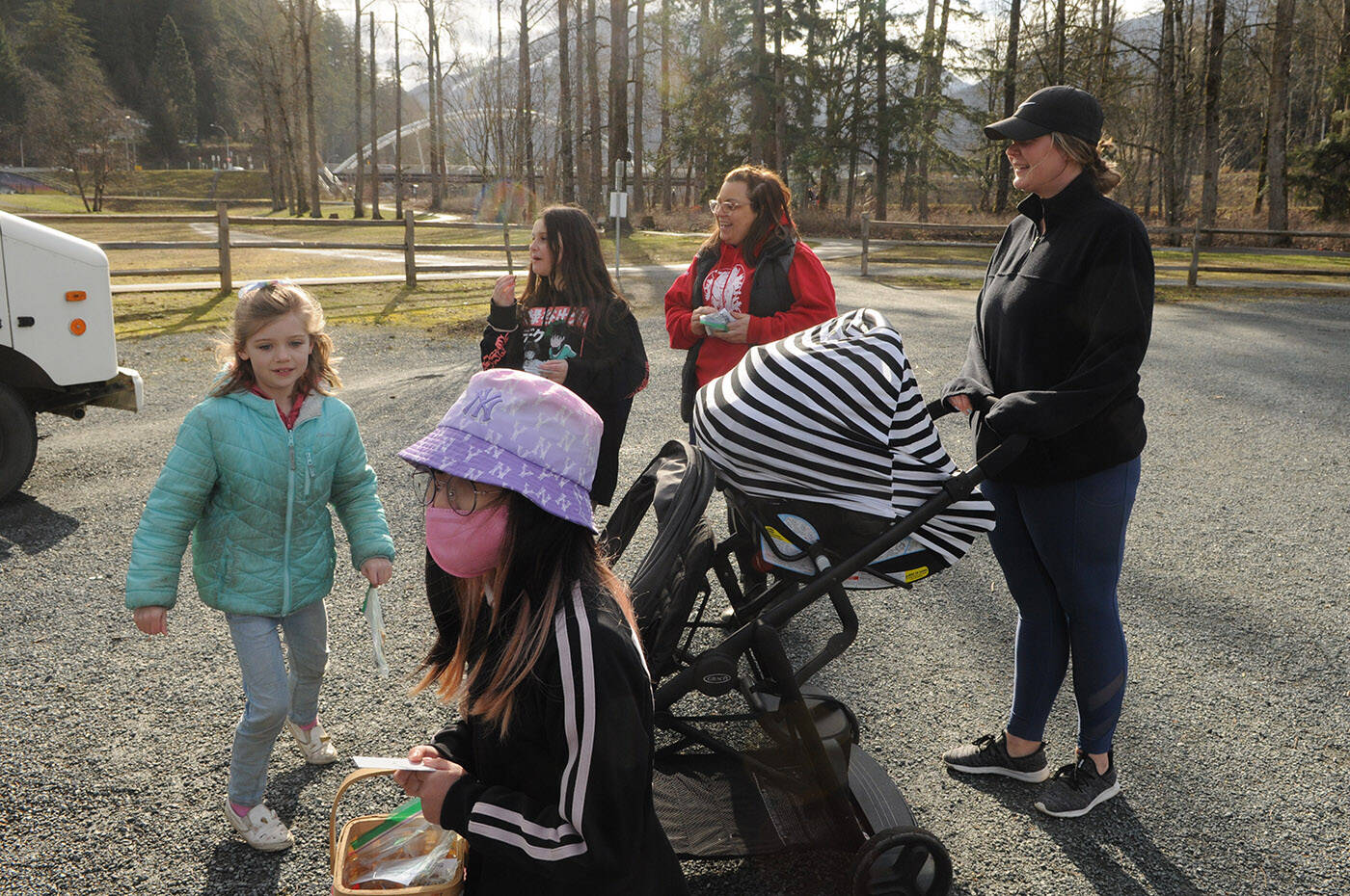 Kids from Watson Elementary prepare to buy a stranger a coffee as teacher Jen Thiessen (red sweatshirt) smiles at Vedder Park during Watson Elementarys Kindness Project on Wednesday, March 15, 2023. (Jenna Hauck/ Chilliwack Progress)