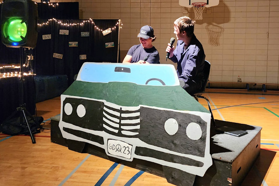 Connor Adair and Andrew Harris emcee the Barriere Grad Fashion Show. (Hettie Buck photo)