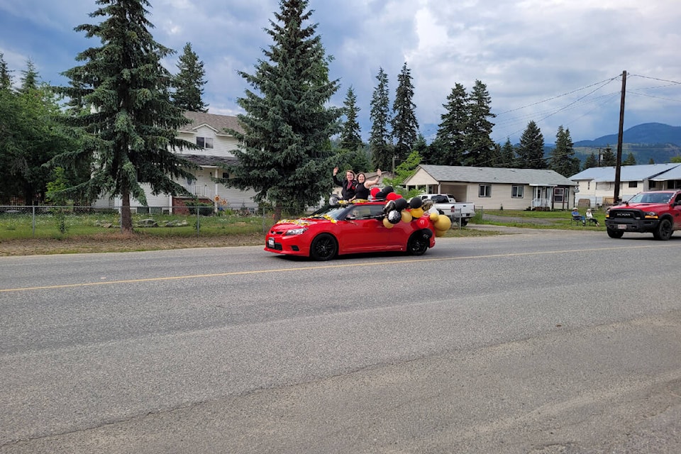 33133947_web1_Front-resized-Red-convertible-grad-parade-20230624_173738
