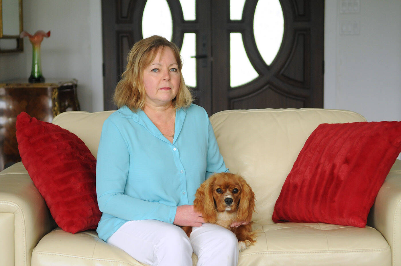 Jill Hall, pictured in her Chilliwack home with puppy Bluebell on Oct. 17, 2023, is a non-smoker who was diagnosed with lung cancer and is now warning people of the risks of radon. (Jenna Hauck/ Chilliwack Progress)