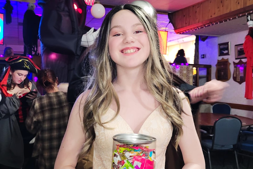 Adalyn McLean is pretty thrilled with her candy guess that won her the prize at the Barriere Legion Family Halloween Dance on Oct. 25. 