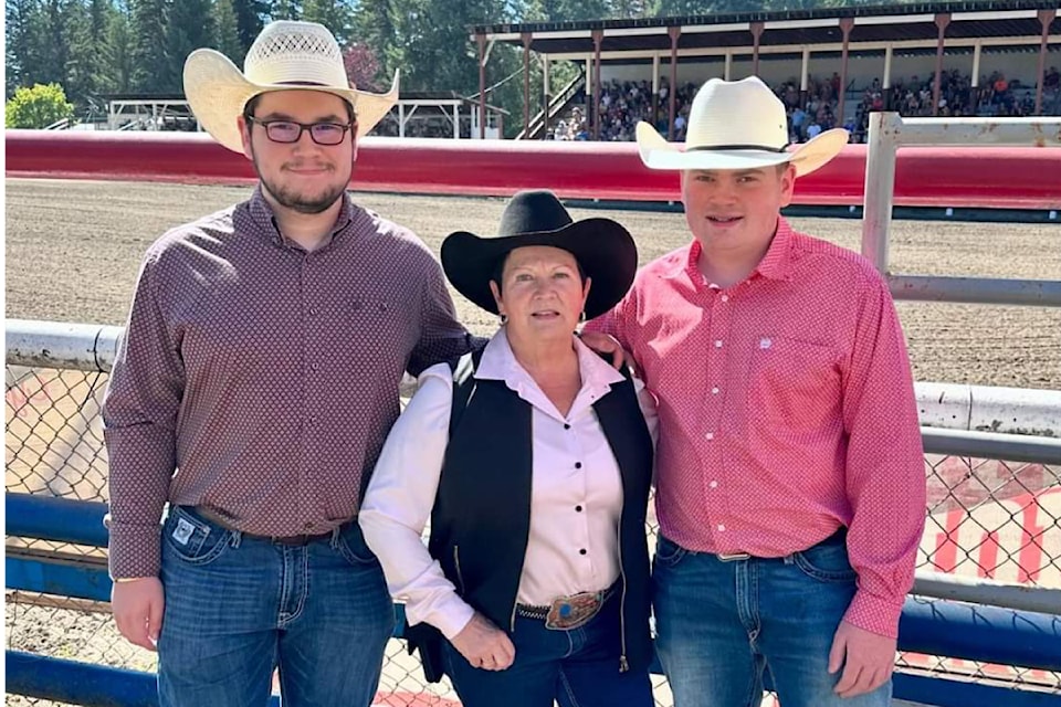 Carmen Ross, director and chair of the NTFFRA Rodeo, was honoured on Saturday for 40 years of dedication to the annual rodeo. She is pictured with her grandsons Tanner (left) and Teagan Tutt (right).