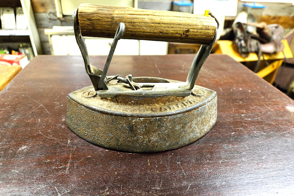 The sad iron was heated on a cast iron stove and some households had two irons to have one heating while the other was being used. 
