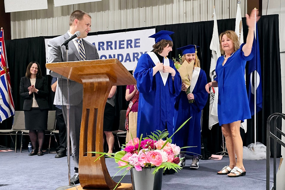 Retiring Barriere Secondary School secretary Kristine Luison, right, being honoured during graduation in June for her years of service. 