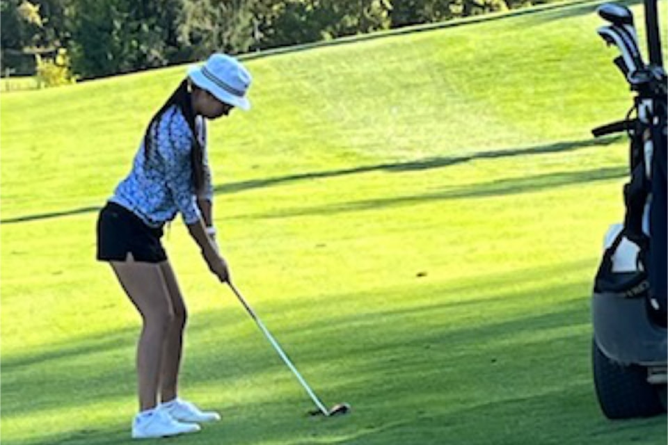 Monica Lee, seconds before taking her shot on the last night of Ladies Golf at Chinook Cove on Sept. 10. 