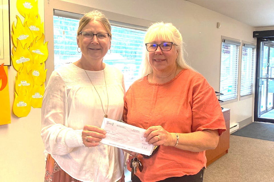 (from l): Holly Fenrick, branch manager for Interior Savings Insurance, presenting a cheque for $1,000 to Pam Simpson, administrator for Yellowhead Pioneer Residence.
