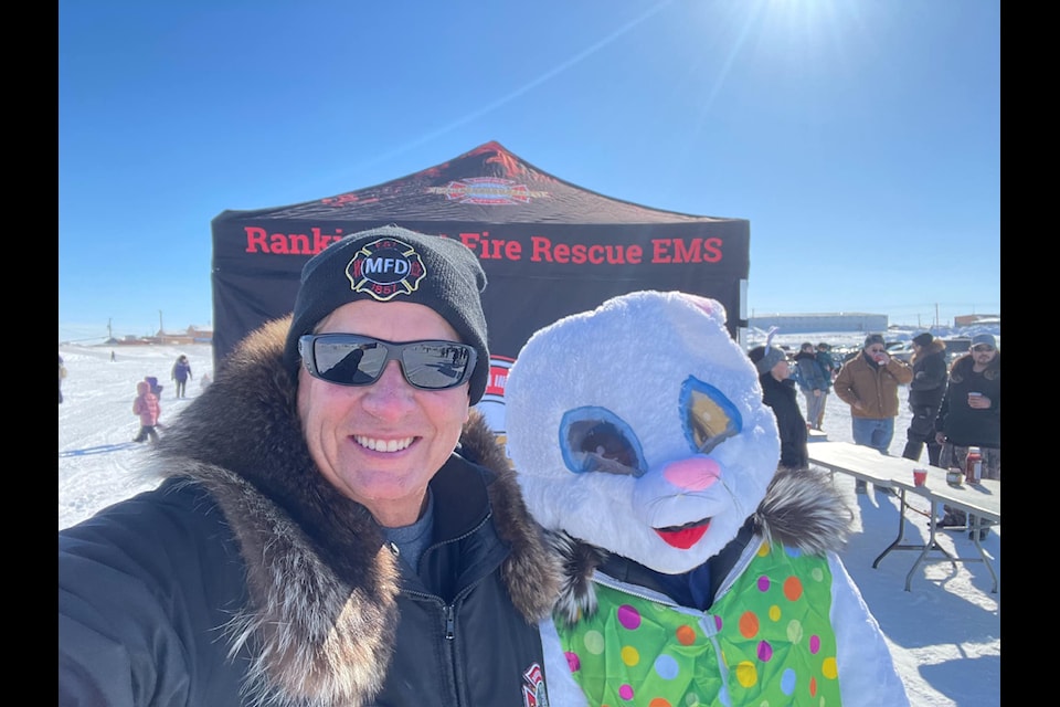 Rankin Inlet Fire Chief Mark Wyatt gets to spend some fun times with a very special bunny during the 2024 Easter Egg Hunt in Rankin Inlet on April 19, 2024.